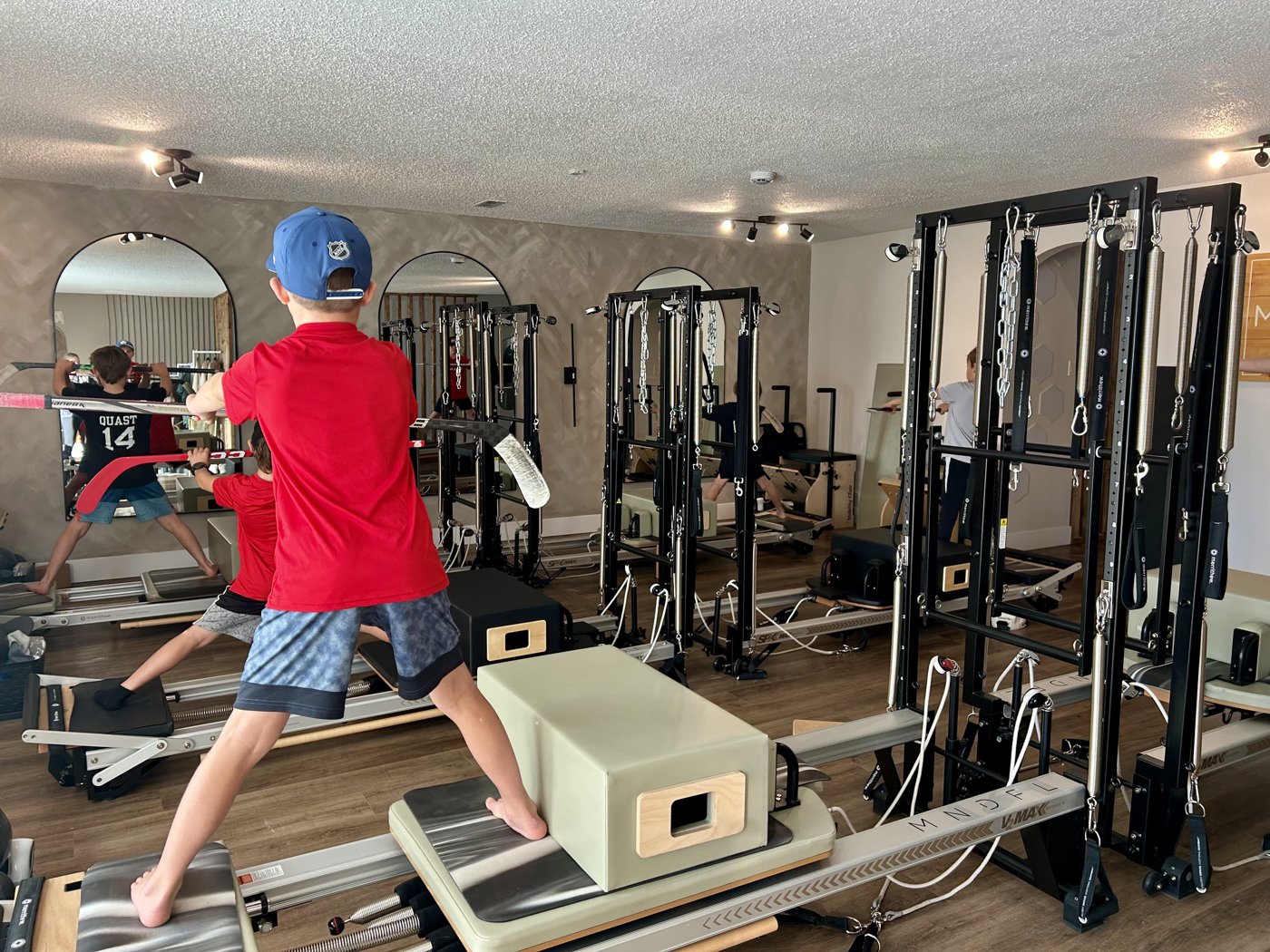 Young hockey players training on the reformer at MNDFL